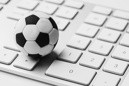 Keyboard with soccer ball.