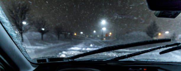 istock Winter Driving in Night Blizzard Snow Storm 1433649784