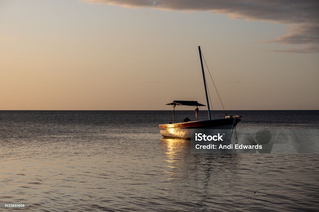 Sunset over fishing boats and commerical tankers, Tombeau Bay, Mauritius Sunset over fishing boats and commerical tankers, Tombeau Bay, Mauritius, Africa Africa Stock Photo