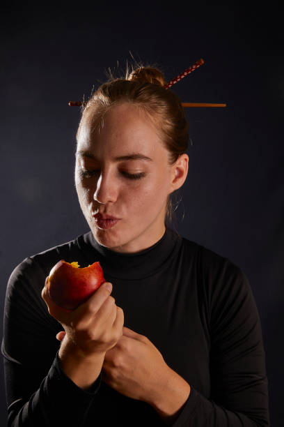istock young lady eating vegan 1433653782