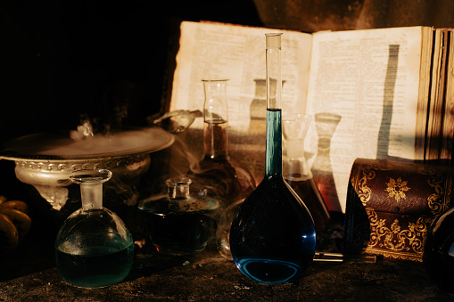 Smoking cauldron, magic potions and spell book
