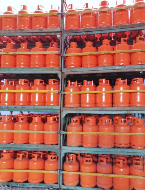 istock Stacks of orange color LPG gas cylinder 1433657586