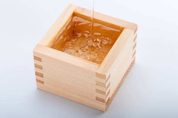 istock Pour Japanese sake into a masu 1433663074