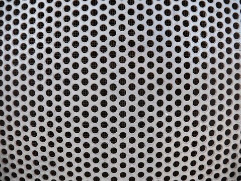 Nice photo of a close-up of round patterns on a radiator