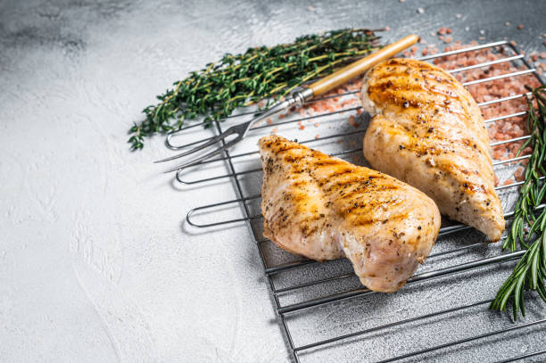istock Grilled chicken breasts steaks cooked on a summer BBQ. Gray background. Top view. Copy space 1433668180