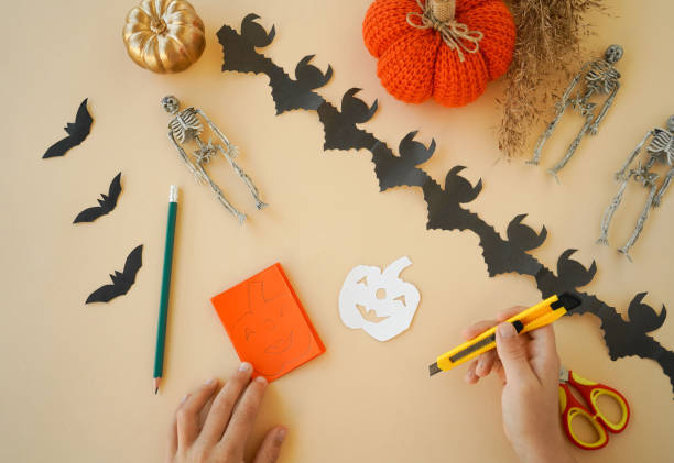istock Step-by-step instructions for creating garlands of paper decorations by children for the Halloween holiday. Step 4 1433673755