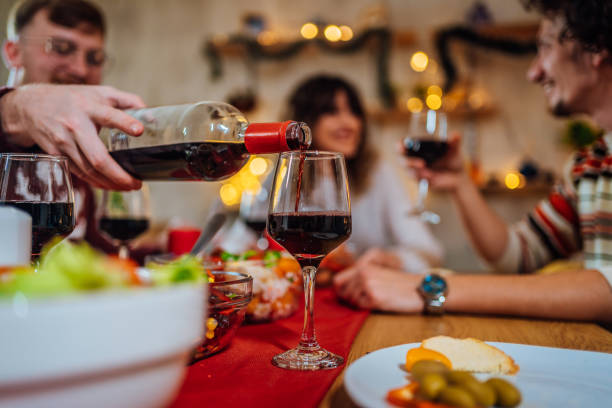 istock Pouring red wine into a glass 1433674933
