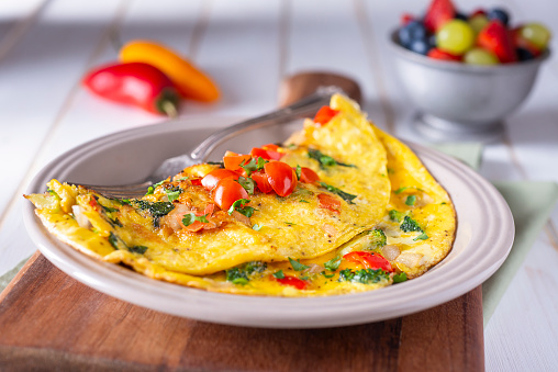 Homemade Vegetable Omelet with Tomato, Broccoli, Spinach, Onion and Red Bell Pepper