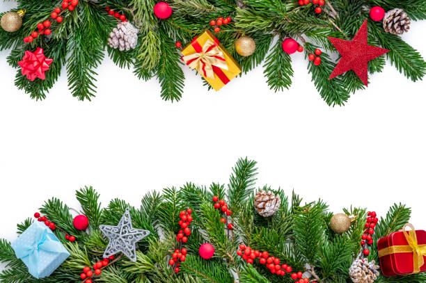 istock Christmas fir tree and holly berries border frame with gift boxes fin cones and star isolated on white 1433677268