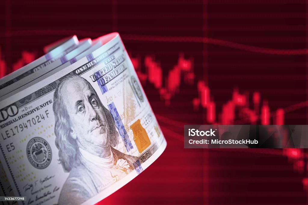 Finance Concept - 100 American Dollar Bills Over Red Bar Graph 100 American Dollar bills over red bar graph background. Horizontal composition with copy space. Finance concept. US Paper Currency Stock Photo
