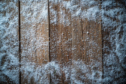 Christmas winter snow background on rustic wood board background copy space
