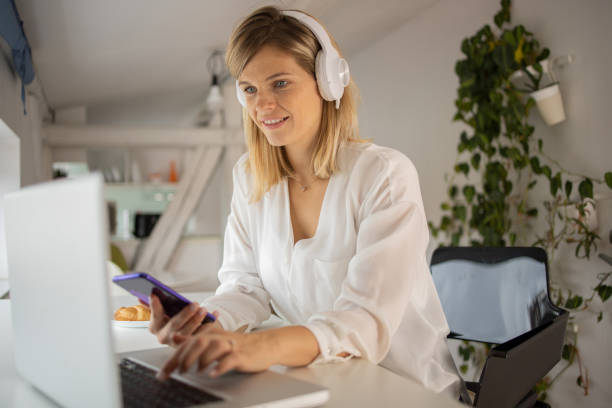 istock Mid adult woman working from home 1433679744