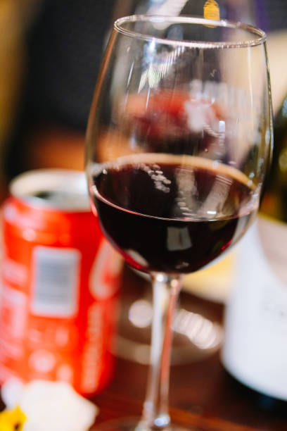 istock Wine glass with a soft drink in the background. 1433683925