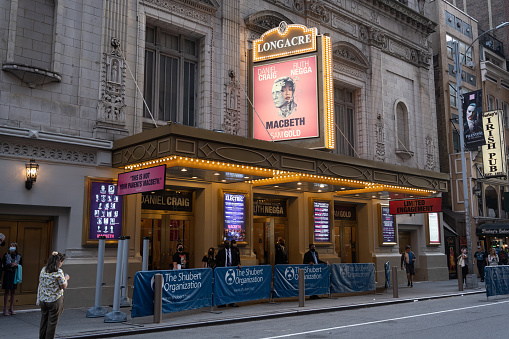 Schenectady New York, USA — August 3, 2021: The marquee of Proctor's Theater, a local Schenectady landmark, lights up State Street.