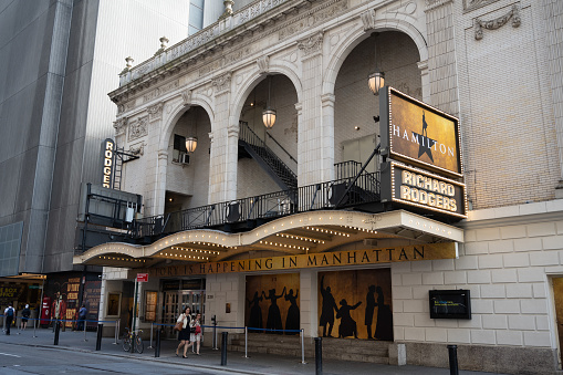 Schenectady New York, USA — August 3, 2021: The marquee of Proctor's Theater, a local Schenectady landmark, lights up State Street.