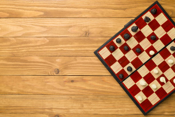 istock Chess on wooden background, top view 1433690639