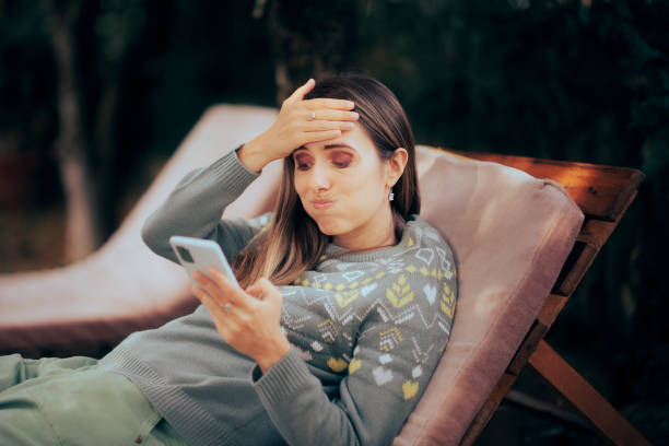 istock Confused Woman Receiving Work Related Text Message on Vacation 1433693623