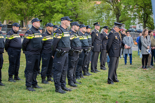 The Hague, Netherlands - May 04 2022: dutch uniformed police men and women walking in official memorial parade