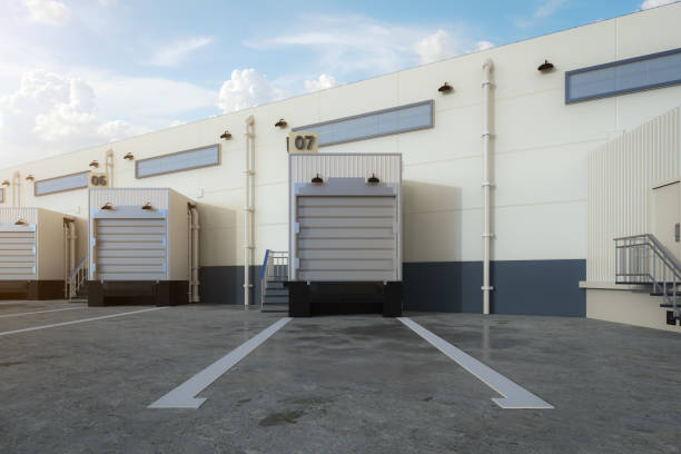istock Warehouse exterior with shutter doors and truck parking lots 1433695977