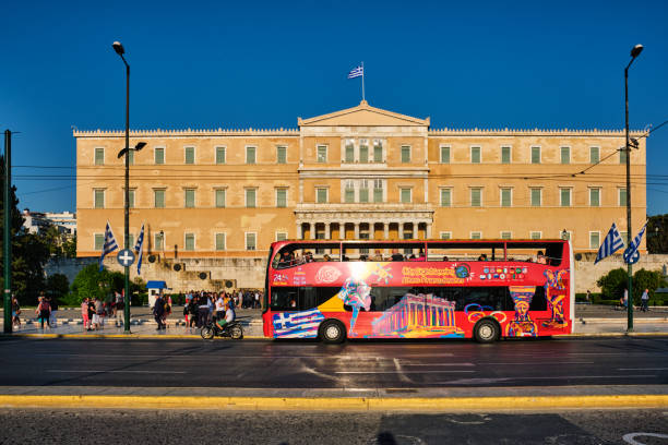 Tourist bus on road in front of Hellenic Parliament stock photo