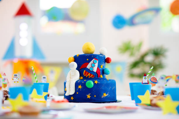 istock Kids space theme birthday party with cake. 1433698530