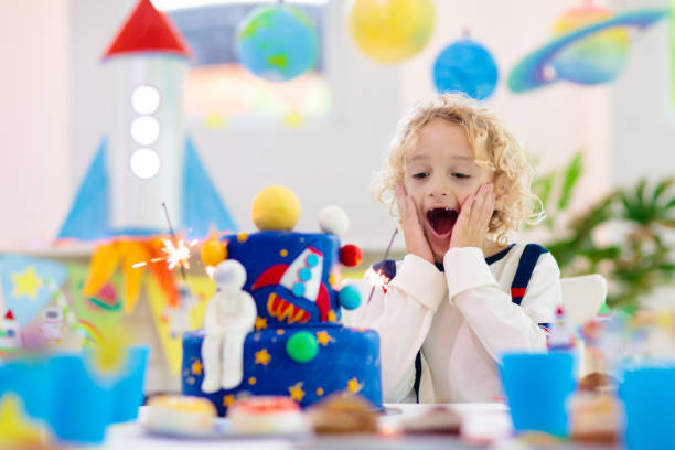 istock Kids space theme birthday party with cake. 1433699885