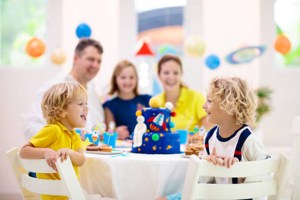 kids space theme birthday party with cake. - earth globe mother child imagens e fotografias de stock