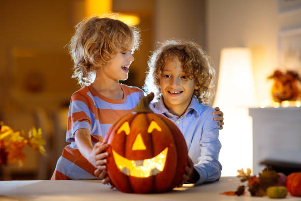 istock Family carving pumpkin for Halloween 1433700836