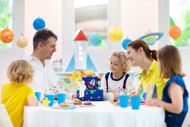 istock Kids space theme birthday party with cake. 1433700839