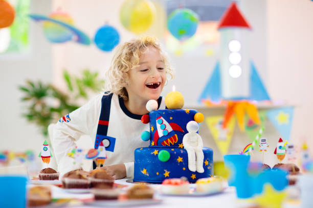 istock Kids space theme birthday party with cake. 1433701560