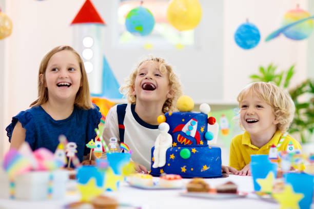 istock Kids space theme birthday party with cake. 1433701572