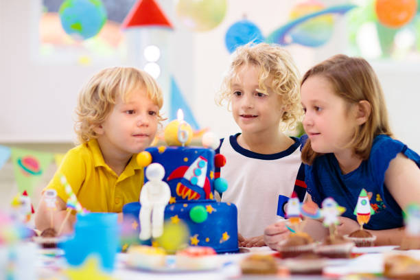 istock Kids space theme birthday party with cake. 1433701621