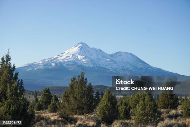 Snowy Mountains In The Distance Stock Photo - Download Image Now - Distant, Mountain, Mountain Peak