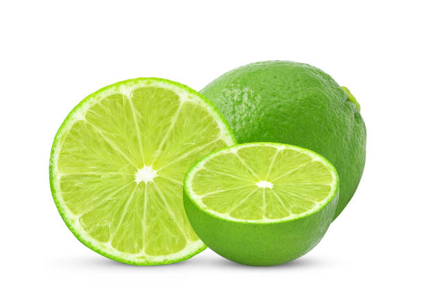 istock Whole and slices of fresh lime fruit isolated on white 1433708345