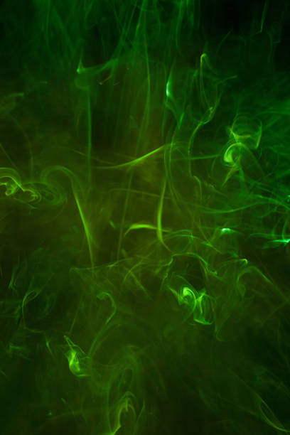 istock Green smoke motion on black background. 1433709755