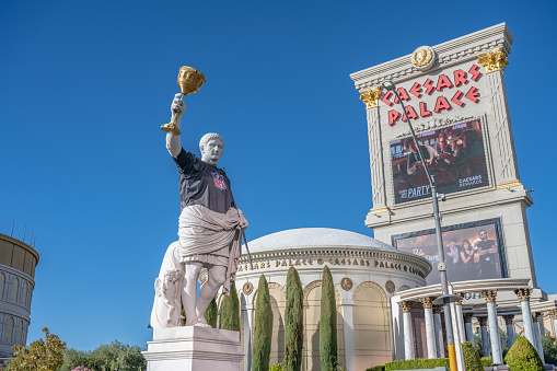 Las Vegas, NV - November 21, 2021: The famous statue of Caesar at Caesar's Palace Hotel and Casino dressed in an NFL jersey, advertising the casino's Sportsbook betting.