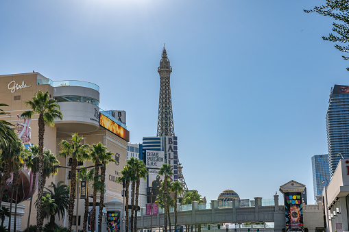 Las Vegas, NV - November 24, 2021: The Replica Eiffel Tower visible in the distance at the Paris Hotel and Casino on Las Vegas Boulevard.