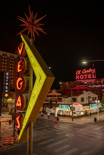 Las Vegas, NV - November 24, 2021: Nighttime view of the famous Vegas neon sign above Fremont Street, downtown, with the El Cortez casino in the background.