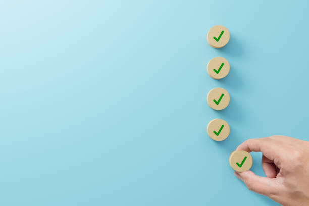 istock Checklist and check mark concept. Check mark on wooden blocks on light blue background 1433720263