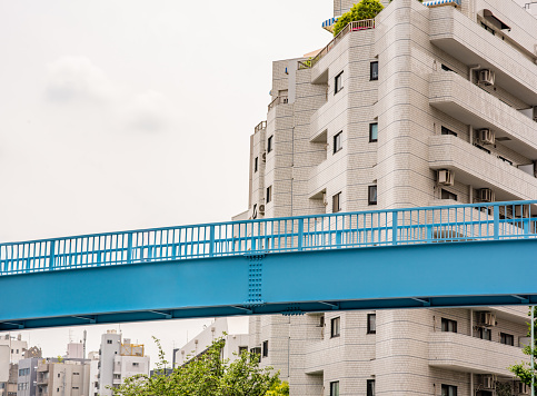 Beautiful blue pedestrian bridge in the Nakameguro area of Shibuya in Tokyo, Japan.