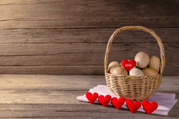 istock eggs in a wicker basket with heart-shaped on wooden table 1433724222