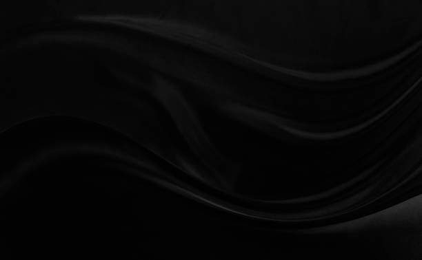 istock Black gray satin dark fabric texture luxurious shiny that is abstract silk cloth background with patterns soft waves blur beautiful. 1433724472