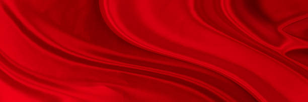 istock Black red satin dark fabric texture luxurious shiny that is abstract silk cloth background with patterns soft waves blur beautiful. 1433725044
