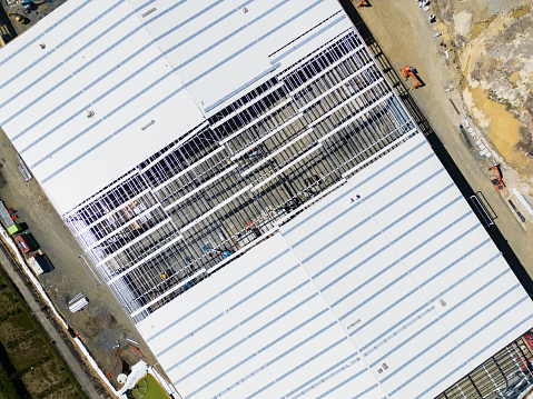 Overhead view of industrial shed, aerial view.