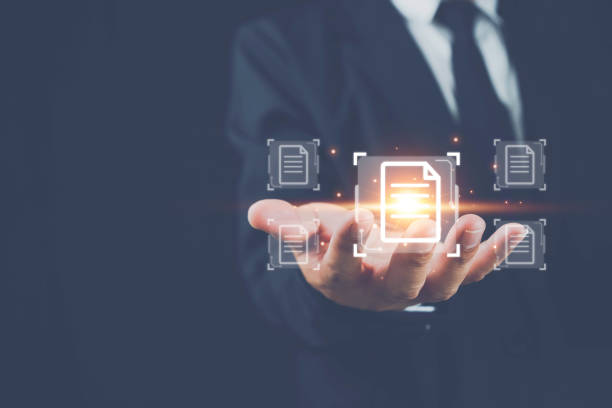istock Hand shows with document icons and typing to laptop computer an using phone, Online documentation database and document management system concept. Process automation to efficiently manage files. 1433728993