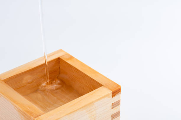 istock Pour Japanese sake into a masu and copy space 1433738690