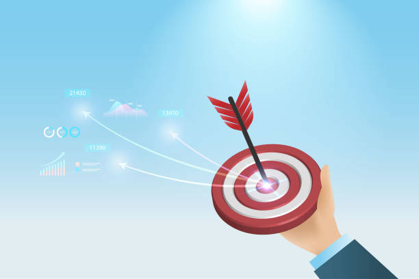 istock Success business marketing target. Businessman hand hold dartboard hit on red target with growth graph and business report. Achievement, goal and competitive in business marketing and strategy. 1433746842