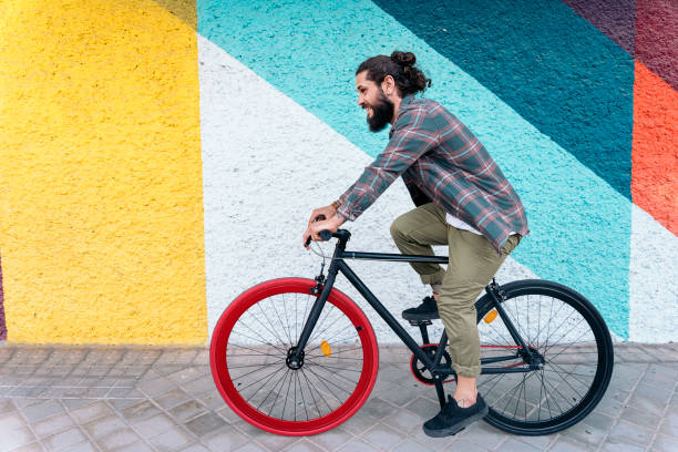 istock Happy Man Riding his Bike 1433746891