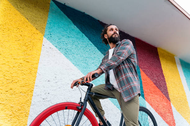 istock Confident Man Riding Bike 1433746897