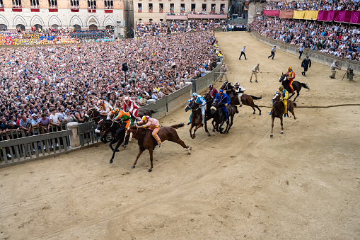 Siena, Tuscany, Italy - August 17 2022: Palio di Siena Horse Race Start at the Mossa on the Piazza del Campo.